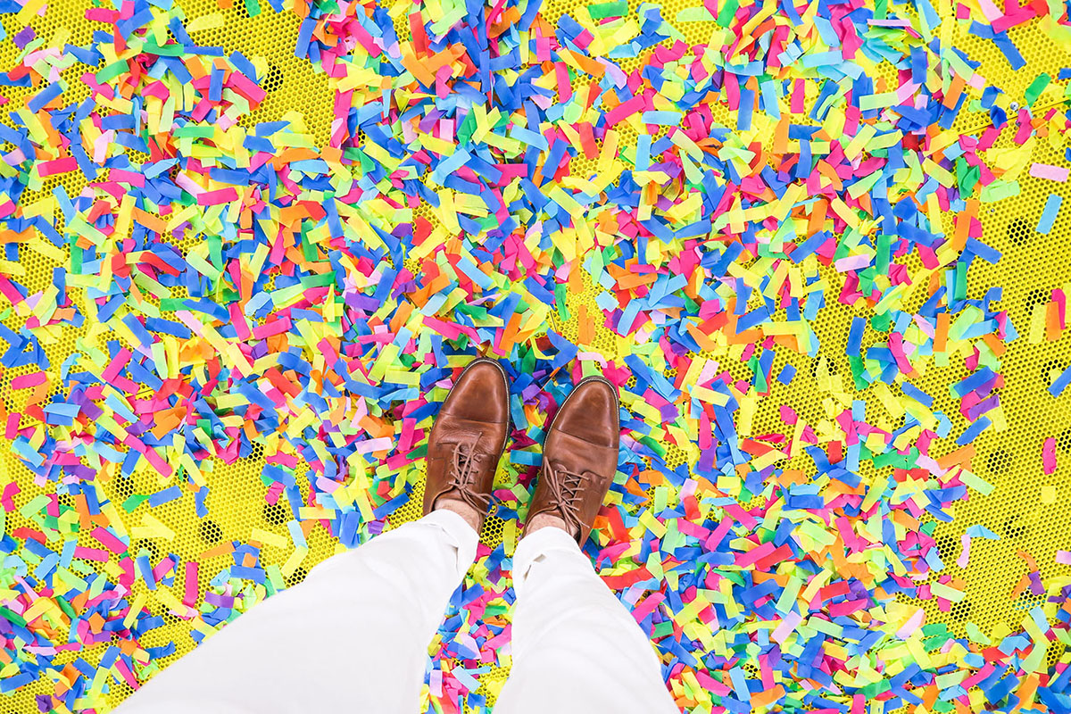 A Man Is Standing on Confetti. - Eventdrive Blog Article