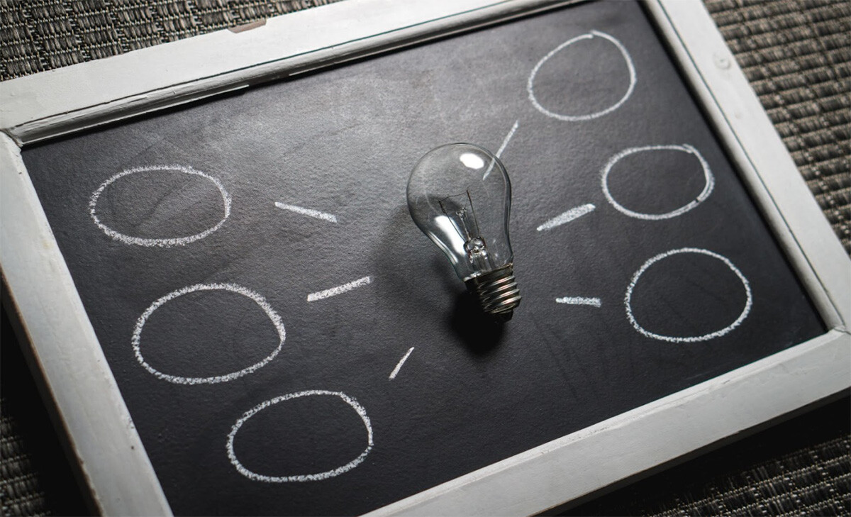 A Light Bulb Is Placed on a Chalkboard. - Eventdrive Blog Article