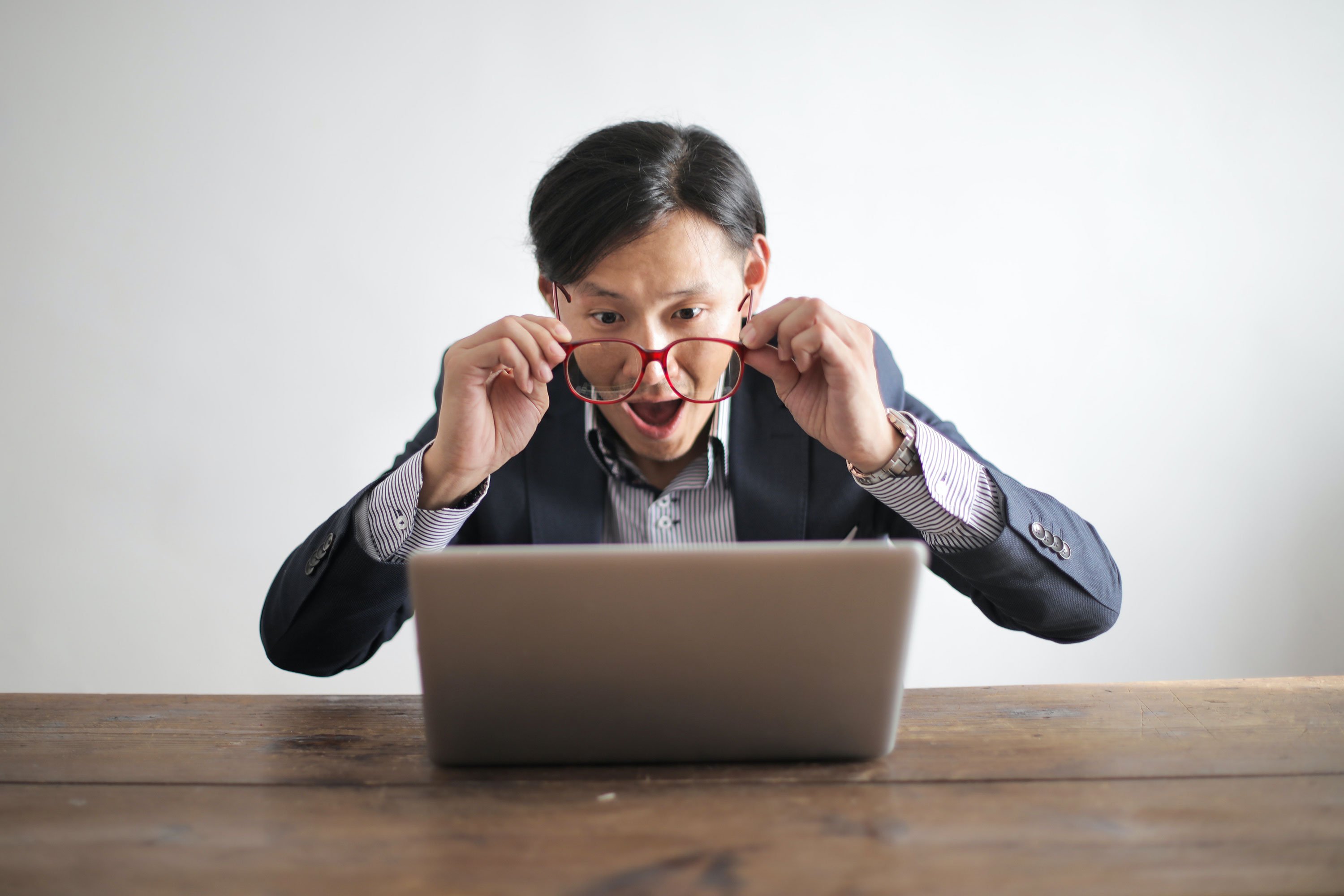 A Man, Visibly Surprised, Stares at His Computer Screen With an Expression of Amazement. - Eventdrive Blog Article