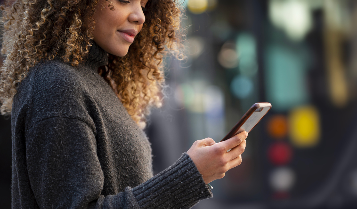 A woman checks her mobile phone - Eventdrive article