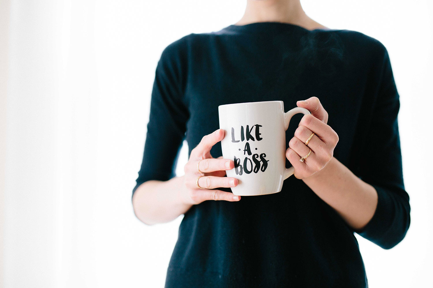 A Woman Is Holding a Tea Cup With 