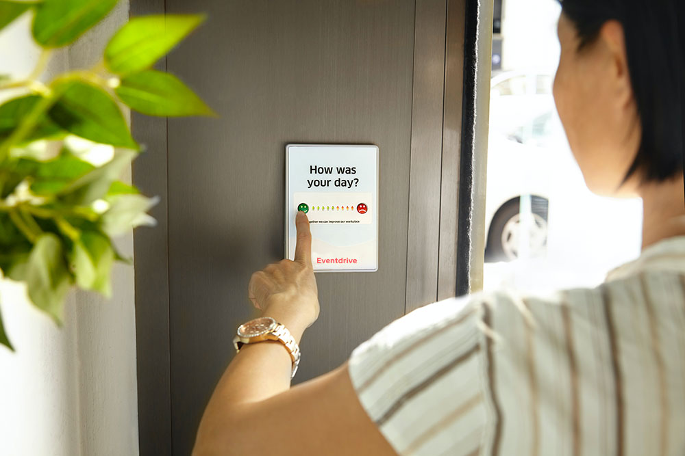 A Person Interacts With a Touchscreen Displaying the Question 